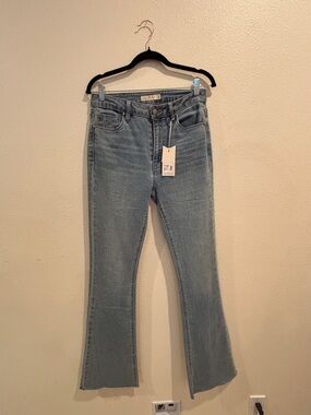 Unpublished Jan Mid Rise Flare Jeans Size 29 Light Wash Raw Hem NWT